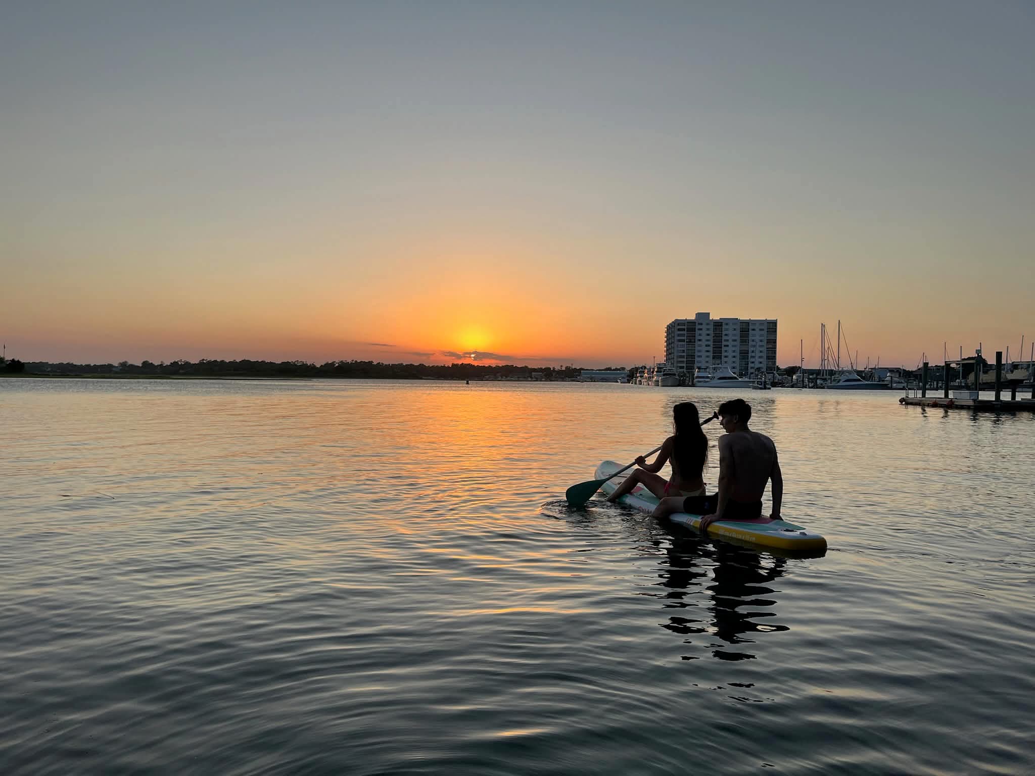 Relaxing on a paddleboard on calm water